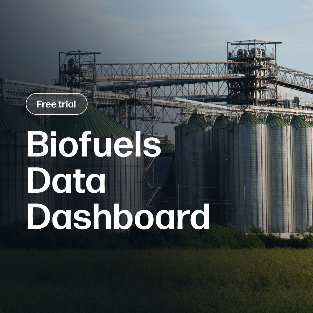 Industrial biofuel storage silos and processing structures under bright daylight, illustrating market data and analysis for the Biofuels Data Dashboard Subscription.