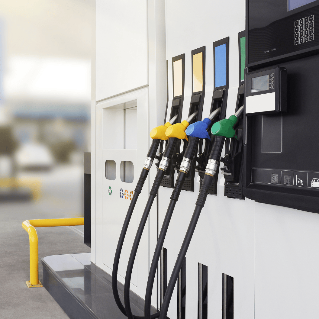Close-up of a modern fuel pump station with multiple color-coded nozzles for dispensing gasoline and diesel, illustrating expert insights and exclusive market analysis for energy commodity trends and Market Reports Subscriptions.